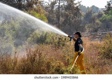 Maale Hahamisha, Israel - June 10th, 2021: An Israeli Fire Fighter Fighting A Large Forest Fire Near Jerusalem, Israel.