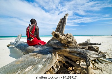 Maasai sitting by the ocean on the beach - Shutterstock ID 94151917