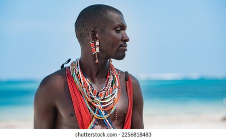 Maasai warrior on the beach. Diani Beach, Kenya Mombasa - Powered by Shutterstock