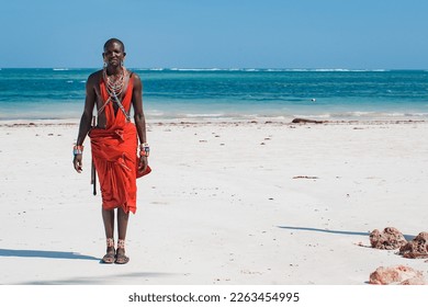 Maasai warrior on the beach. Diani Beach, Kenya Mombasa - Powered by Shutterstock