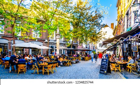 Maastricht, Limburg / the Netherlands -  Sept. 21, 2018: Many restaurant and pub terraces and patios to hang out with friends in the center of the historic city of Maastricht in the Netherlands