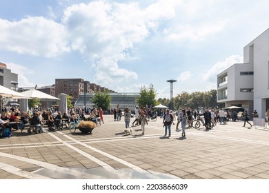 Maastricht, The Netherlands, September 11 2022. City Centre Square With Shops, Stores And An Outdoor Market With People Walking And Shopping On A Sunny Festive Day In Limburg, Europe