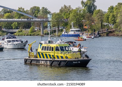 Maastricht, South Limburg, Netherlands. April 27, 2022. Police Boat Controlling The Waters Of The Maas River, King's Day Celebration, Big Party On A Sunny Spring Day. Tradition Of An Orange Festival