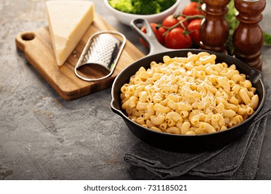 Mac And Cheese In A Cast Iron Pan With Steamed Broccoli