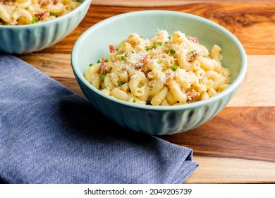 Mac N Cheese. Macaroni Mixed With Melted Cheddar Cheese, Grilled Cajun Shrimp, Crispy Bacon, Jalapeños, Spicy Corn Salsa, And Cilantro. Classic American Bar Appetizer, Loaded Mac N Cheese.