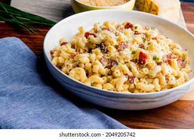 Mac N Cheese. Macaroni Mixed With Melted Cheddar Cheese, Grilled Cajun Shrimp, Crispy Bacon, Jalapeños, Spicy Corn Salsa, And Cilantro. Classic American Bar Appetizer, Loaded Mac N Cheese.