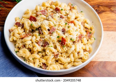 Mac N Cheese. Macaroni Mixed With Melted Cheddar Cheese, Grilled Cajun Shrimp, Crispy Bacon, Jalapeños, Spicy Corn Salsa, And Cilantro. Classic American Bar Appetizer, Loaded Mac N Cheese.