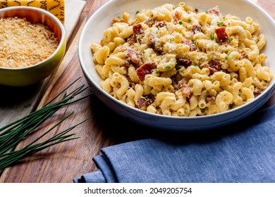 Mac N Cheese. Macaroni Mixed With Melted Cheddar Cheese, Grilled Cajun Shrimp, Crispy Bacon, Jalapeños, Spicy Corn Salsa, And Cilantro. Classic American Bar Appetizer, Loaded Mac N Cheese.