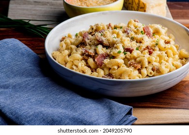 Mac N Cheese. Macaroni Mixed With Melted Cheddar Cheese, Grilled Cajun Shrimp, Crispy Bacon, Jalapeños, Spicy Corn Salsa, And Cilantro. Classic American Bar Appetizer, Loaded Mac N Cheese.