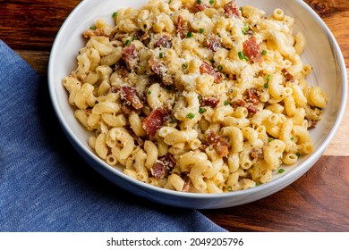 Mac N Cheese. Macaroni Mixed With Melted Cheddar Cheese, Grilled Cajun Shrimp, Crispy Bacon, Jalapeños, Spicy Corn Salsa, And Cilantro. Classic American Bar Appetizer, Loaded Mac N Cheese.