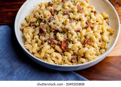 Mac N Cheese. Macaroni Mixed With Melted Cheddar Cheese, Grilled Cajun Shrimp, Crispy Bacon, Jalapeños, Spicy Corn Salsa, And Cilantro. Classic American Bar Appetizer, Loaded Mac N Cheese.