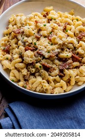 Mac N Cheese. Macaroni Mixed With Melted Cheddar Cheese, Grilled Cajun Shrimp, Crispy Bacon, Jalapeños, Spicy Corn Salsa, And Cilantro. Classic American Bar Appetizer, Loaded Mac N Cheese.