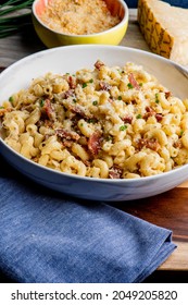 Mac N Cheese. Macaroni Mixed With Melted Cheddar Cheese, Grilled Cajun Shrimp, Crispy Bacon, Jalapeños, Spicy Corn Salsa, And Cilantro. Classic American Bar Appetizer, Loaded Mac N Cheese.