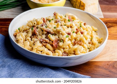 Mac N Cheese. Macaroni Mixed With Melted Cheddar Cheese, Grilled Cajun Shrimp, Crispy Bacon, Jalapeños, Spicy Corn Salsa, And Cilantro. Classic American Bar Appetizer, Loaded Mac N Cheese.