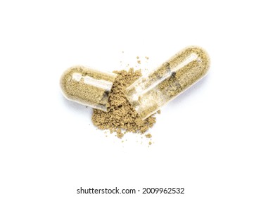 Maca powder and herbal medicine capsule isolated on white background. Top view. Flat lay.