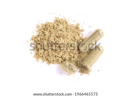 Maca powder and herbal medicine capsule isolated on white background. Top view. Flat lay.