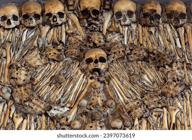 Macabre sculptural design of a wall of bones and human skulls from The Chapel of Bones located in the city of Évora in Portugal. It was built the 17th  at the initiative of three Franciscan monks.