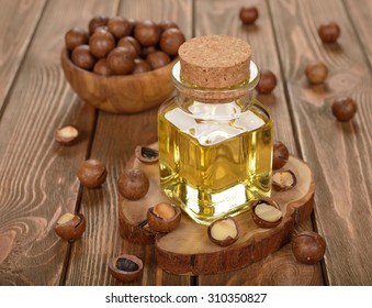 Macadamia Nut Oil On A Brown Background