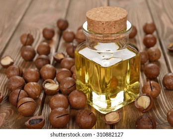 Macadamia Nut Oil On A Brown Background