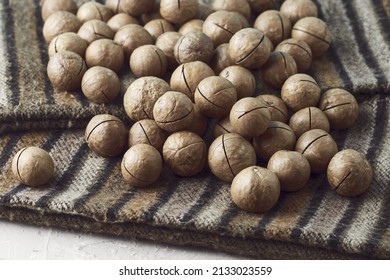 Macadamia Nuts On A Canvas With A Traditional African Ornament. High Quality Photo