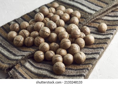 Macadamia Nuts On A Canvas With A Traditional African Ornament. High Quality Photo