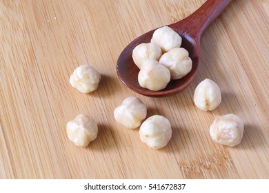  Macadamia In Wood Spoon , And Spread Around Wood Table