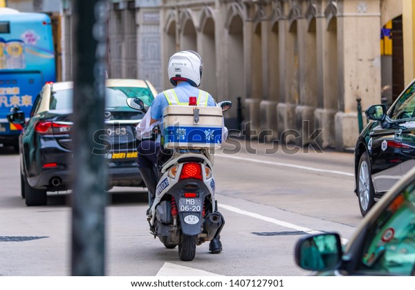 Macao, China - APR\
2019: A Macao police officer patrolled the streets of downtown\
Macau on a police\
motorcycle.