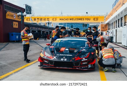 Macao, China- June 20,2022: A Group Of Mechanics Are Working On A Lamborghini Huracan GT3 EVO Hypercar