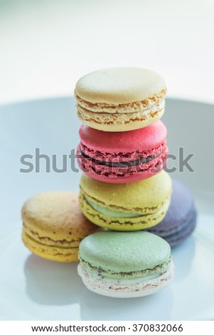 Similar – Image, Stock Photo Three colorful macarons on a plate.