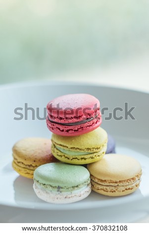 Similar – Image, Stock Photo Three colorful macarons on a plate.