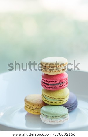 Similar – Image, Stock Photo Three colorful macarons on a plate.