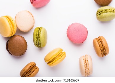 Macaron Cookies Scattered Over White Background, Top View