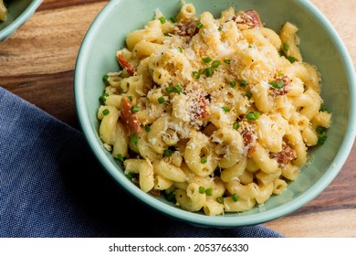 Macaroni And Cheese. Macaroni Mixed With Melted Cheddar Cheese, Grilled Cajun Shrimp, Crispy Bacon, Jalapeños, Spicy Corn Salsa, And Cilantro. Classic American Bar Appetizer, Loaded Mac N Cheese.