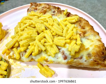 Macaroni and cheese on top of cheese pizza - Shutterstock ID 1997636861