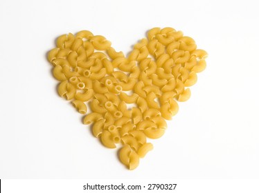 Macaroni Forming A Heart Over White Background. Concept Of Healthy Food.