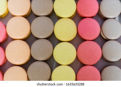 Macaroni pattern on a white background. A lot of cakes