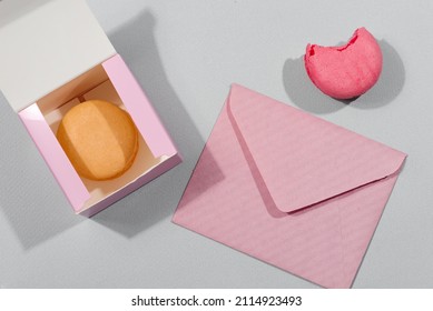 Macarons Cake In Gift Box And Mockup Letter On A Grey Background, St. Valentines Day Concept