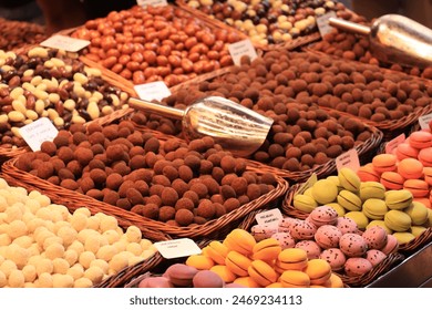 Macarons and chocolates on display on a market - Powered by Shutterstock