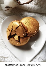 Macarons Gold And Tasty On White Plate Heart