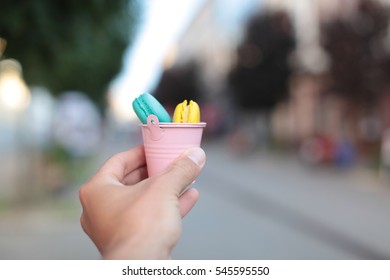macarons in hands