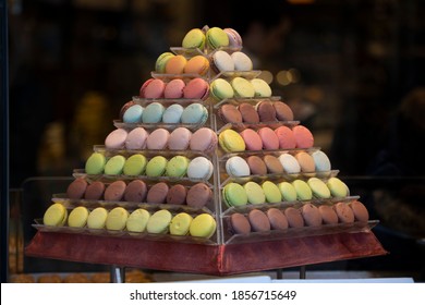 Macarons lined up on the pyramid bench. Close-up. It was taken in front of the bench.