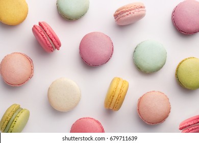 Macarons pattern on white background. Colorful french desserts. Top view