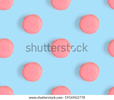 macarons seamless pattern. macarons isolated on blue background, sweets pattern