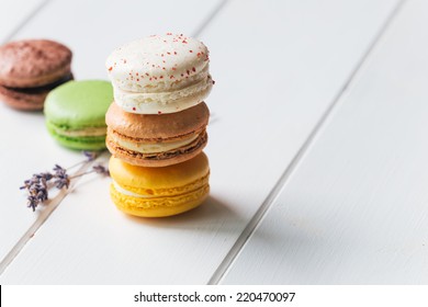 Macarons stack on white wooden background