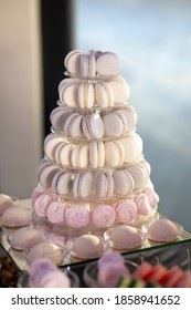 Macaroon tower. A table with desserts for guests at a wedding. Candy bar