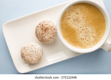 Macaroons and coffee on the table. Studio shoot.