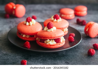 Macaroons. Delicious french desserts. Macaroons with raspberries and cream cheese. Macaroons on the table - Shutterstock ID 2016345182