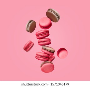 Macaroons on colored background, composition of colorful french cookies macarons. Beige, brown french cookies macarons on colored background. Gift for Valentine's Day - Powered by Shutterstock