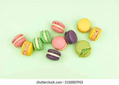 Macaroons On Green Background, High Angle View Of Macaroons Over Green Background