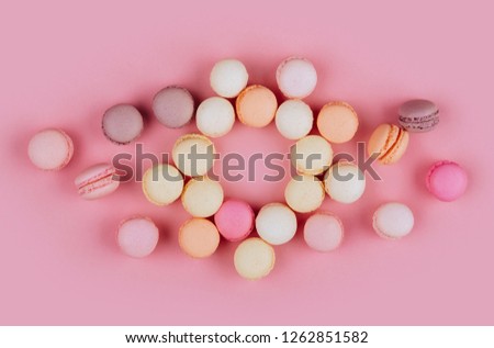 Macaroons in a pink background. Close ups. Space for text.